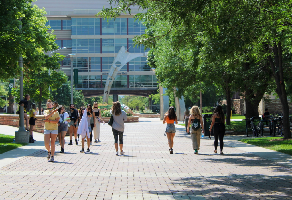 Photo of students walking towards Yates Hall.