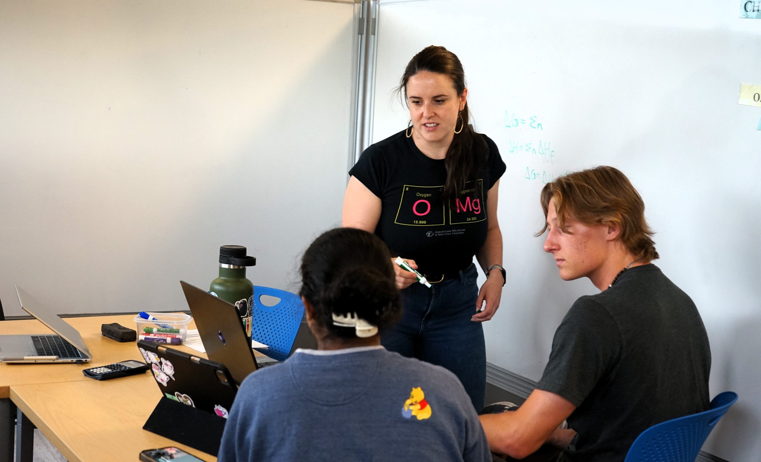 dsc04827 Professor Brittney Morgan helping students with chemistry concepts.