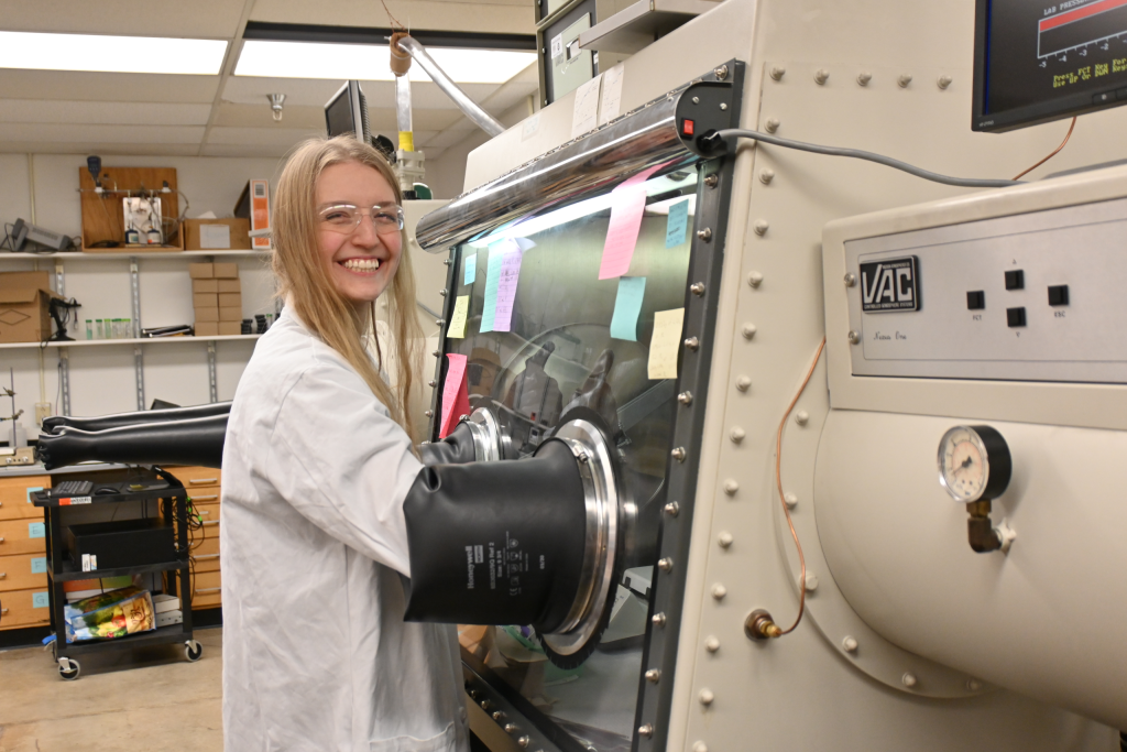 Student operating equipment in a lab